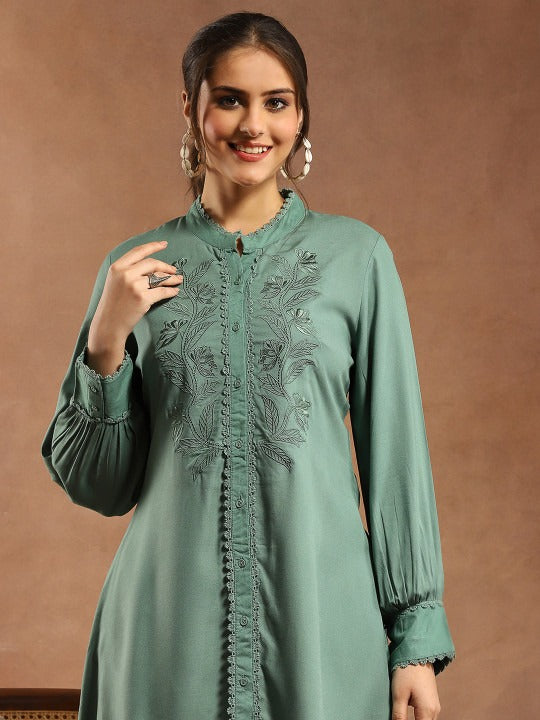Women Solid Embroidered A-line Viscose Rayon Tunic
