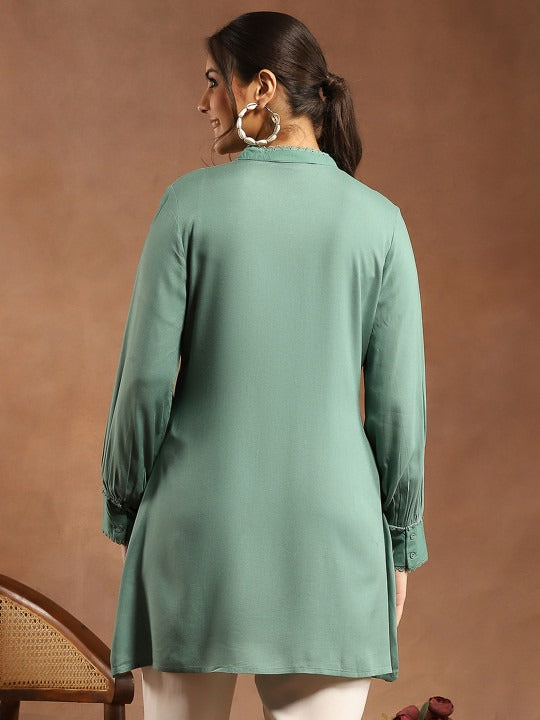 Women Solid Embroidered A-line Viscose Rayon Tunic
